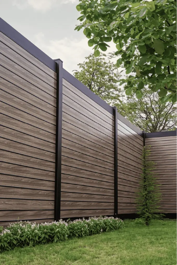 Aluminum privacy plus fence panel installed along a property line