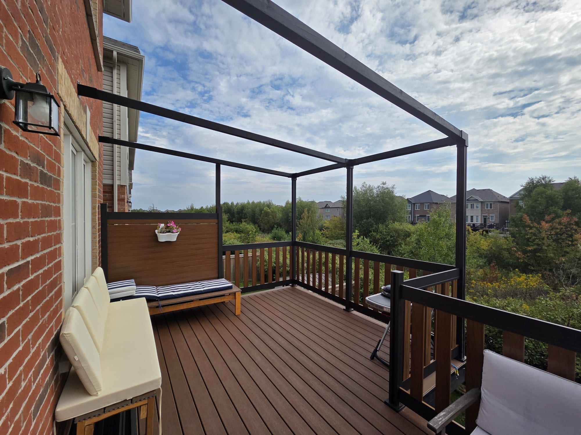 Aluminum railing and fence panel system on a residential deck in Canada