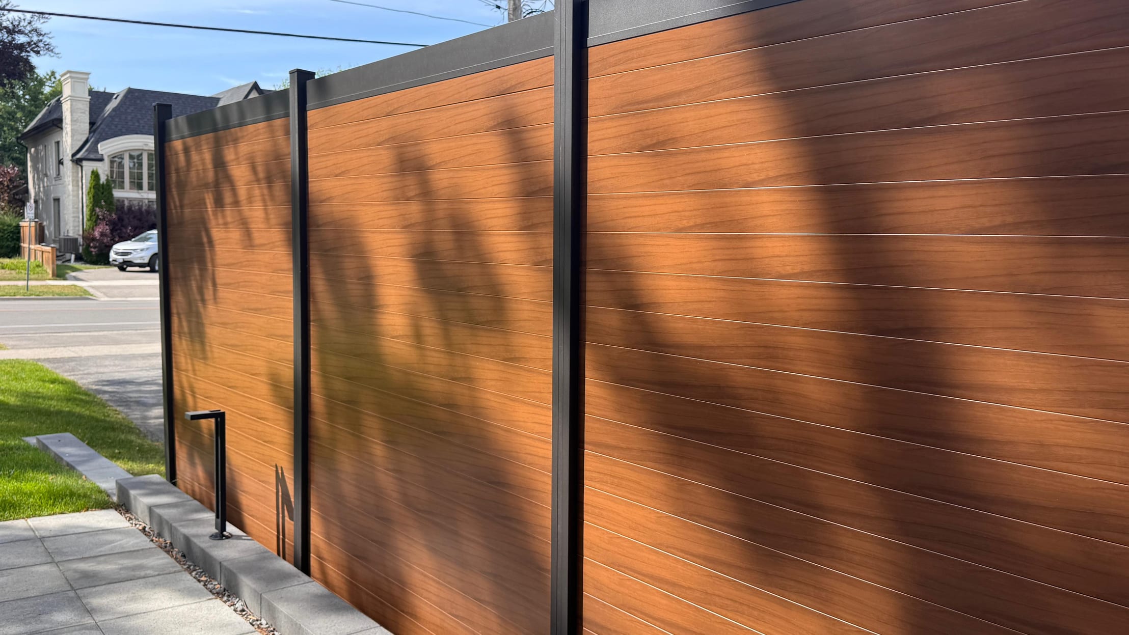 brown aluminum fence panels installed Canada backyard