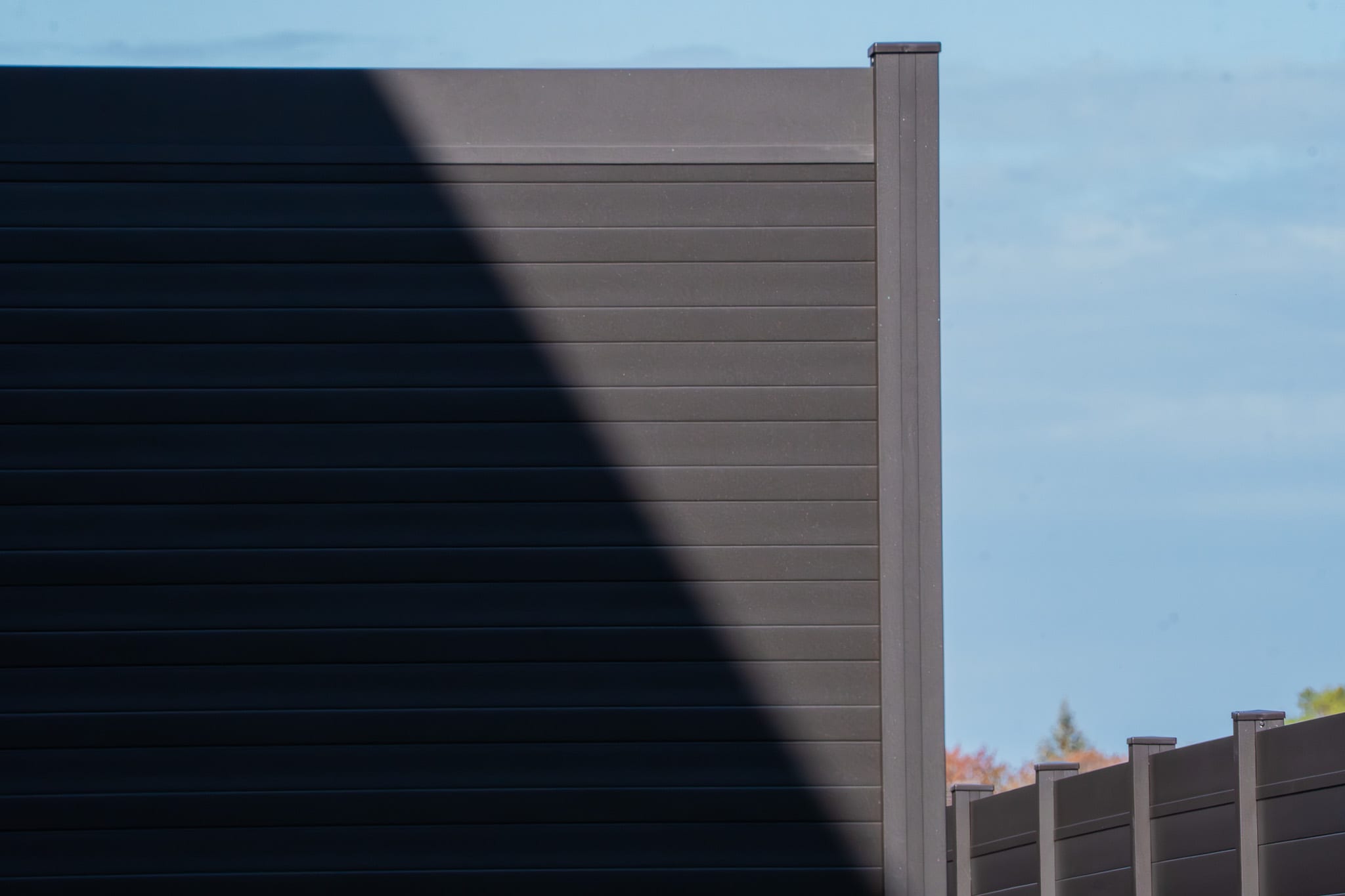 Professional aluminum fence installation on a residential property in Canada